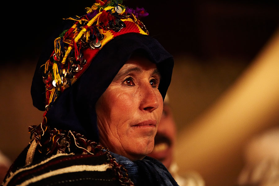  A member of the Ait Hdiddou  (Ait Haddidou) music group is watching one of the other performances on the Imilchil musicfestival